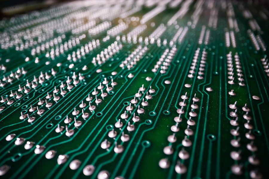 Close up of a green printed circuit board at an angle 7.27