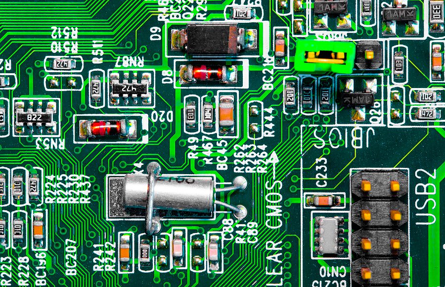 Close-up of green printed circuit board with SMT