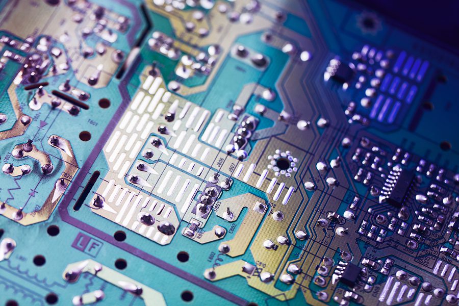 Close up of a printed circuit board showing the details of assembly.