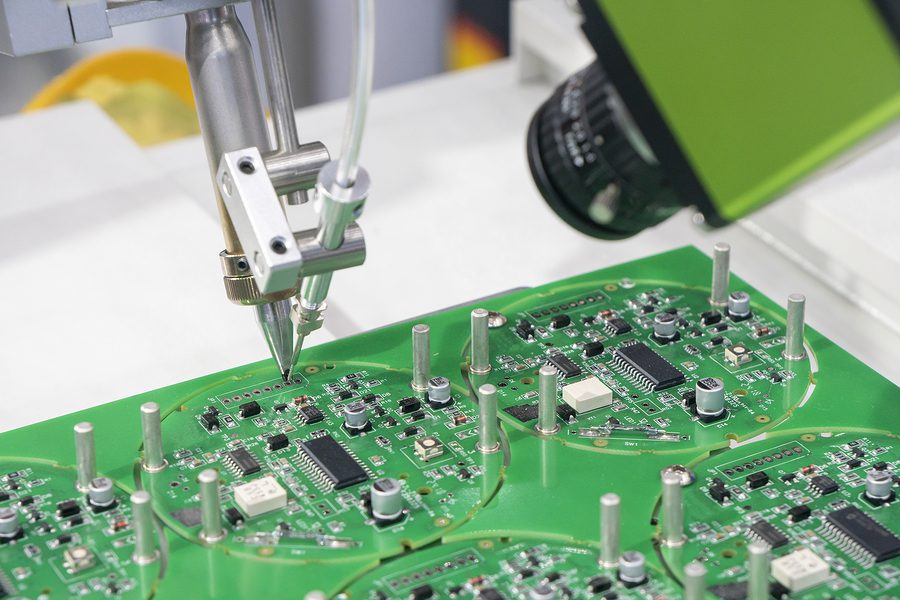 Close up of a printed circuit board being assembled.